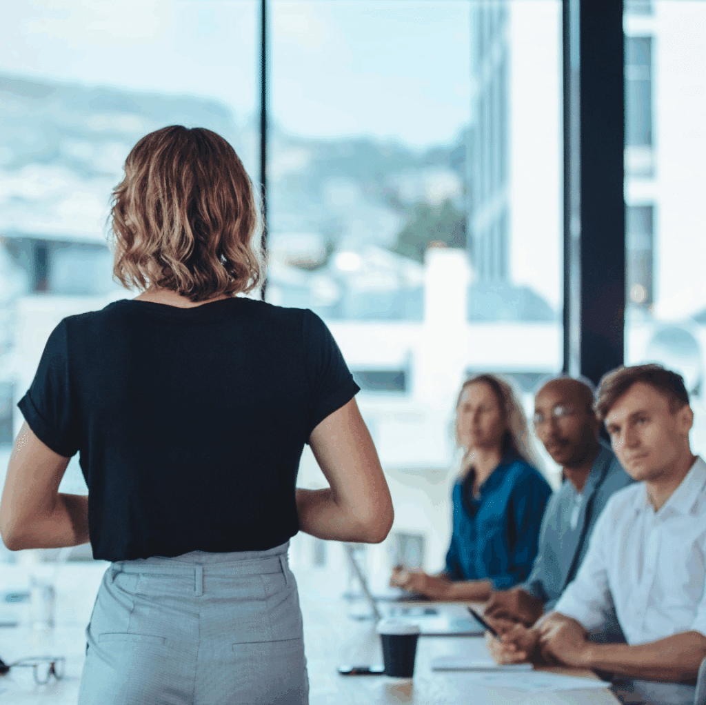 Woman Standing in a Business Meeting