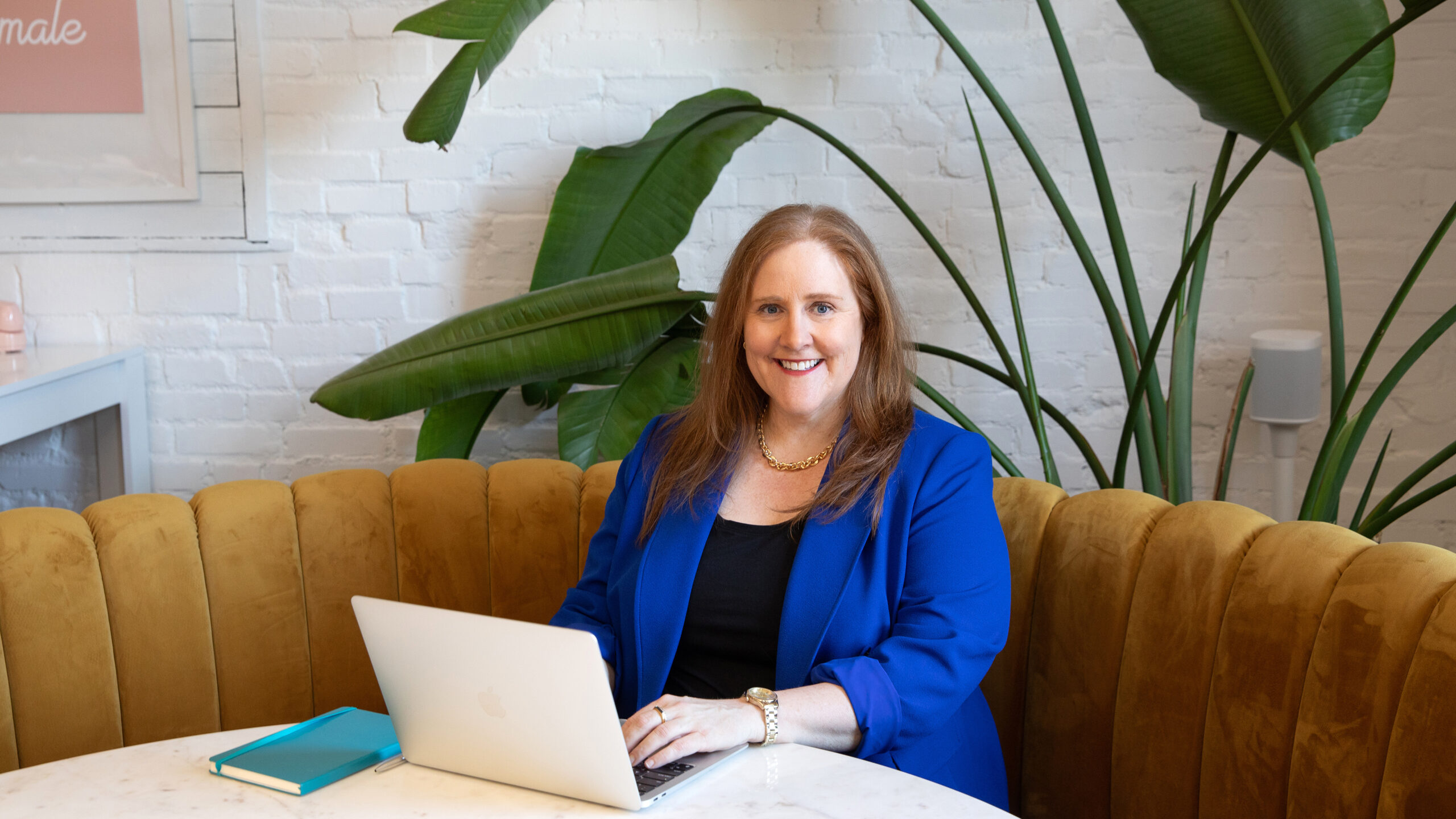 Kristyn Dunlap KayKay Consulting Group working on a laptop